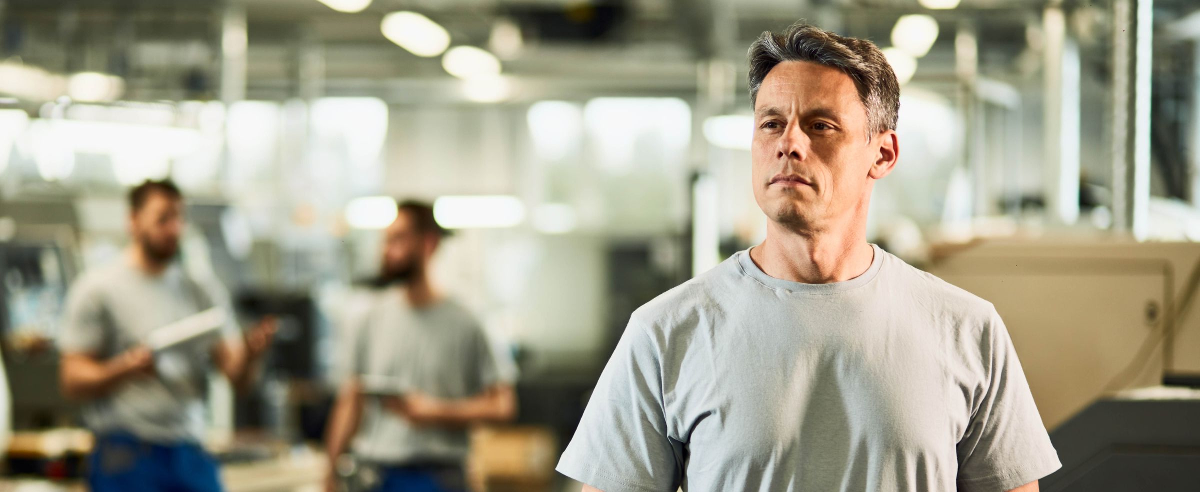 Portrait of industrial facility engineer at production line.